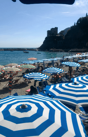 Striped umbrellas on the beach in Monterosso al Mare