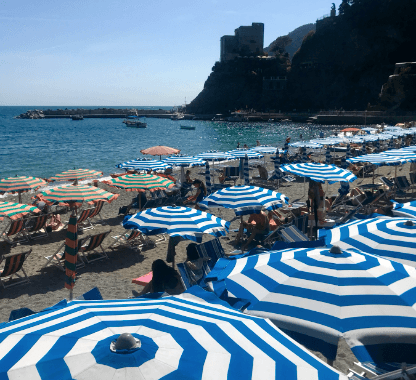 Blue and white striped beach umbrellas in Monterosso al Mare